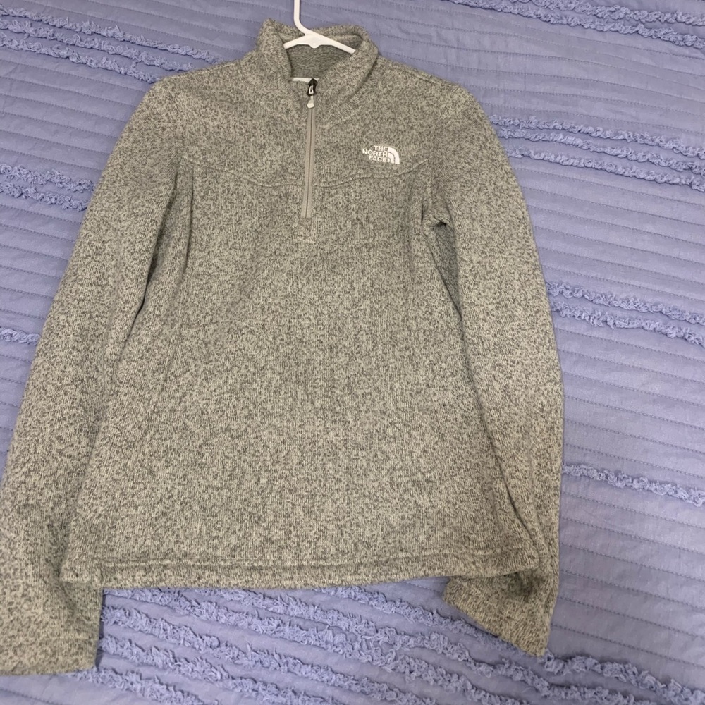North face jacket. Like a white beige gray color